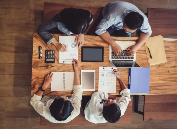 business people sitting around a desk